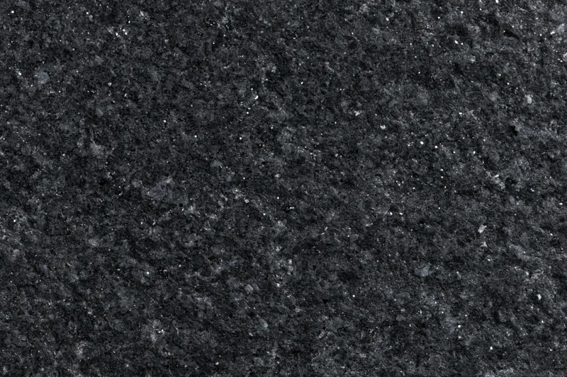 Close-up of polished black granite surface texture