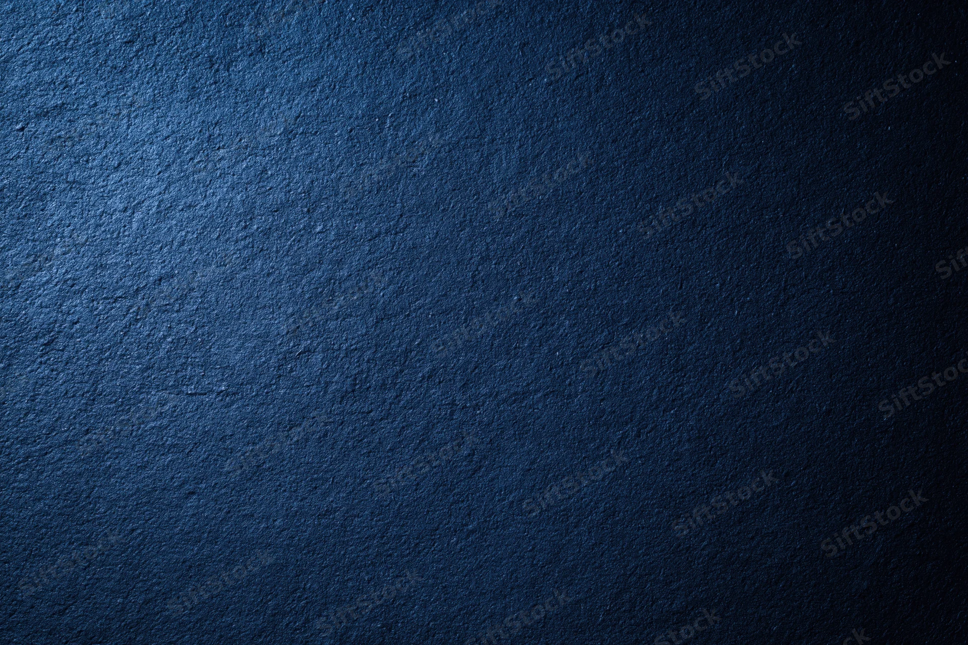Close-up of dark navy blue textured wall surface