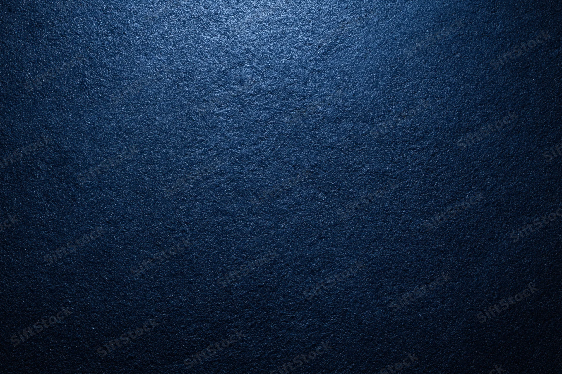 Close-up of dark navy blue textured wall surface