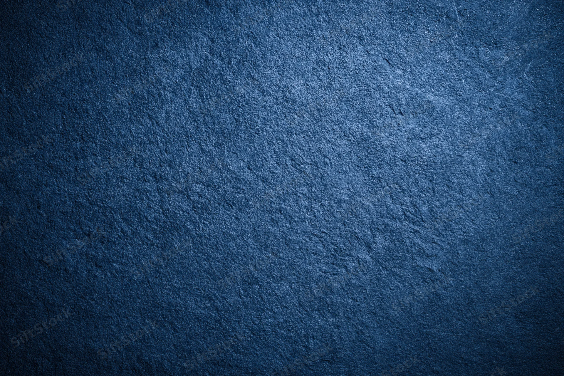 Close-up of dark navy blue textured wall surface