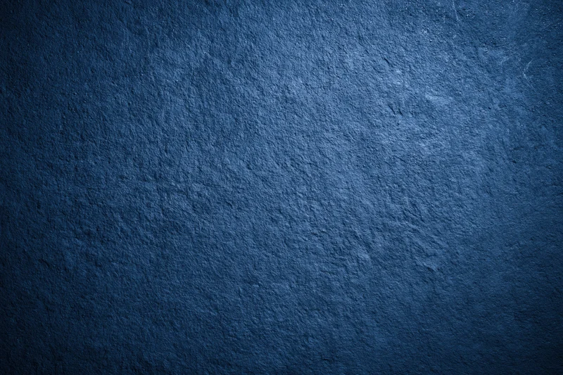 Close-up of dark navy blue textured wall surface