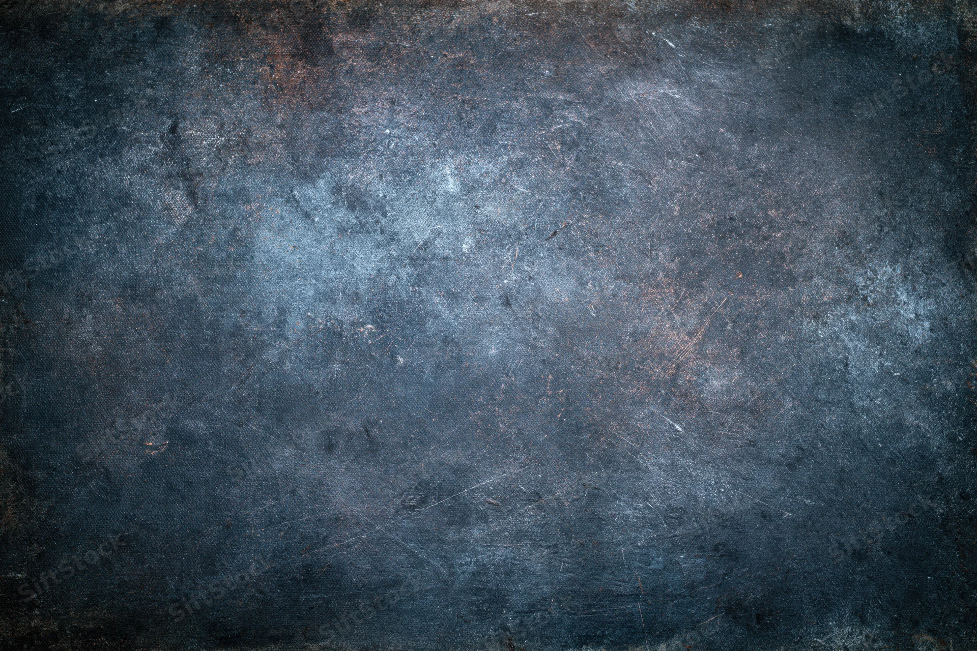 Close-up of a worn painted metal surface with rust and scratches