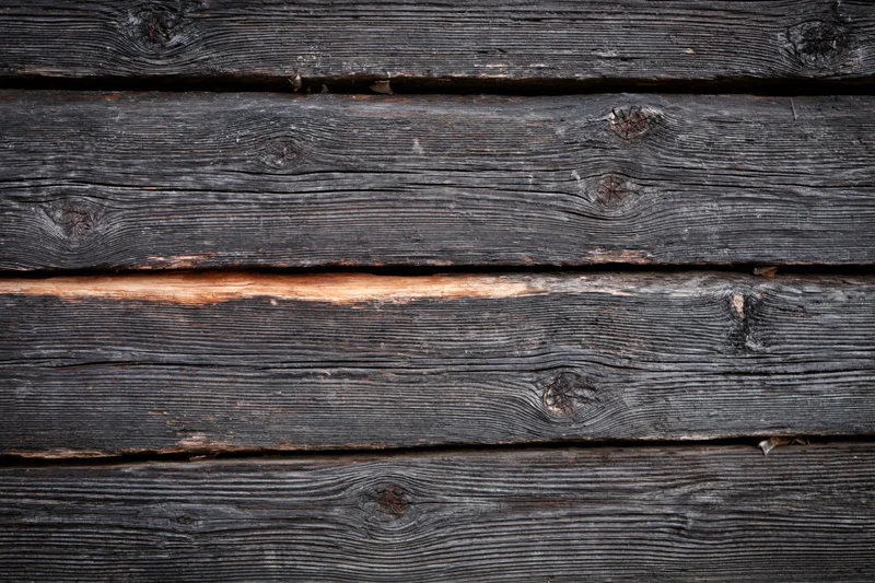 Close-up of weathered horizontal wooden planks forming a textured surface