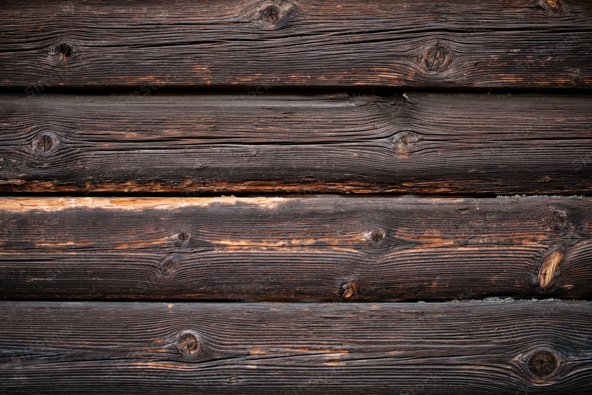 Close-up of weathered horizontal wooden planks forming a textured surface