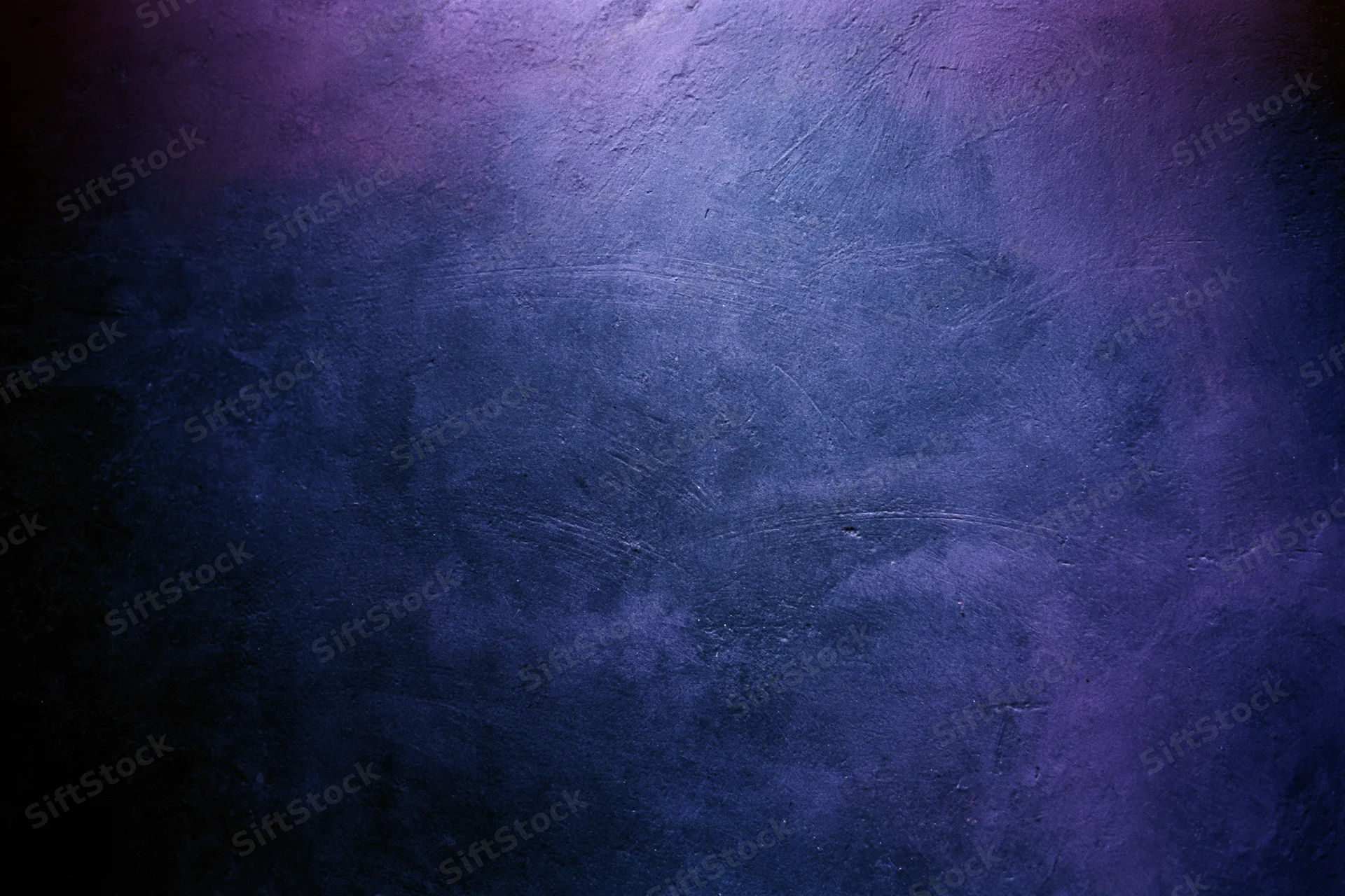 Close-up of a worn concrete wall surface with blue and purple gradient lighting