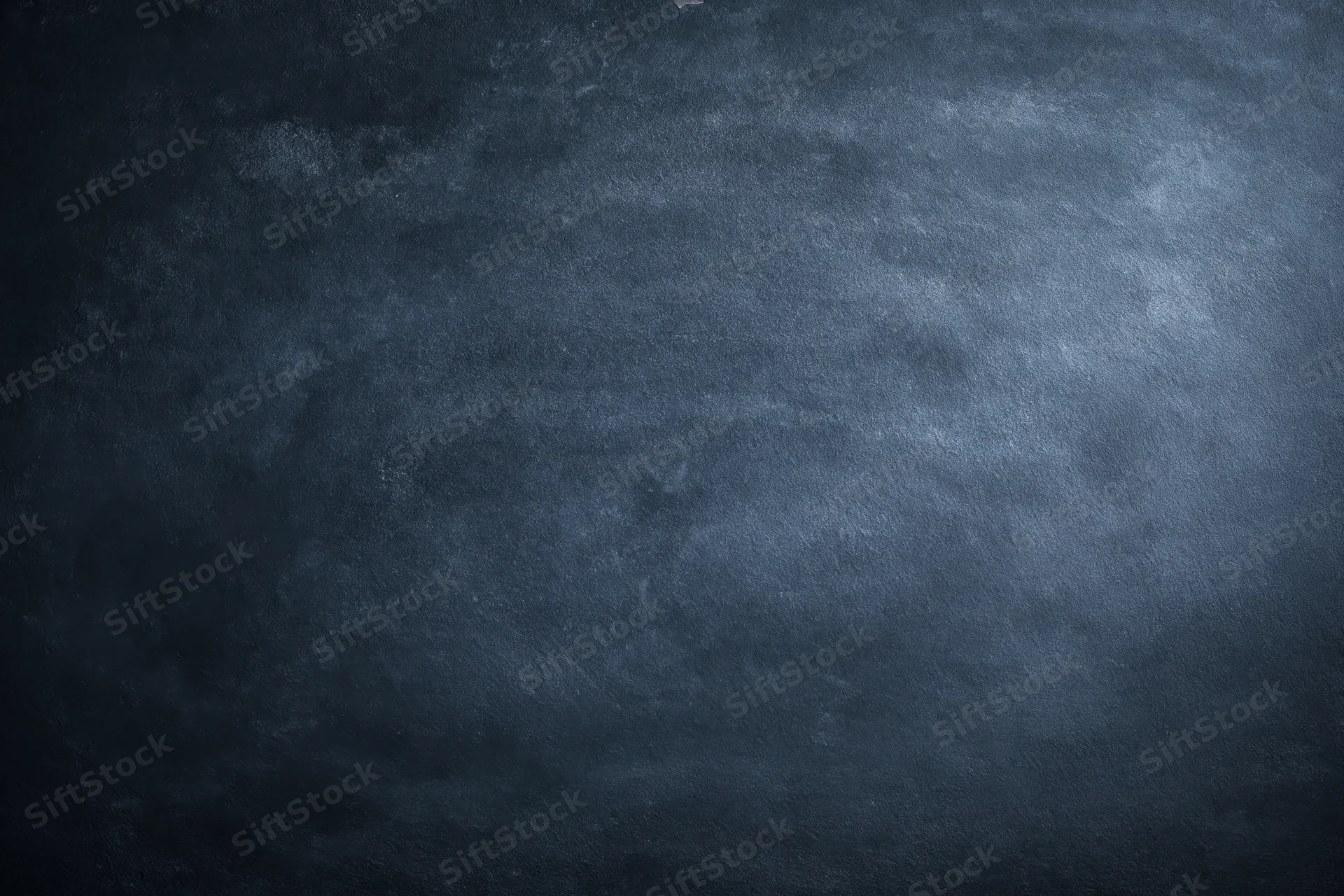 Dark mottled chalkboard surface with aged texture filling the frame