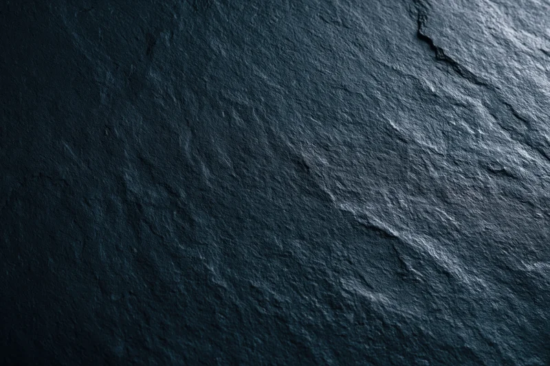 Close-up of dark slate stone surface texture filling the frame