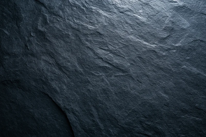 Close-up of dark slate stone surface texture filling the frame