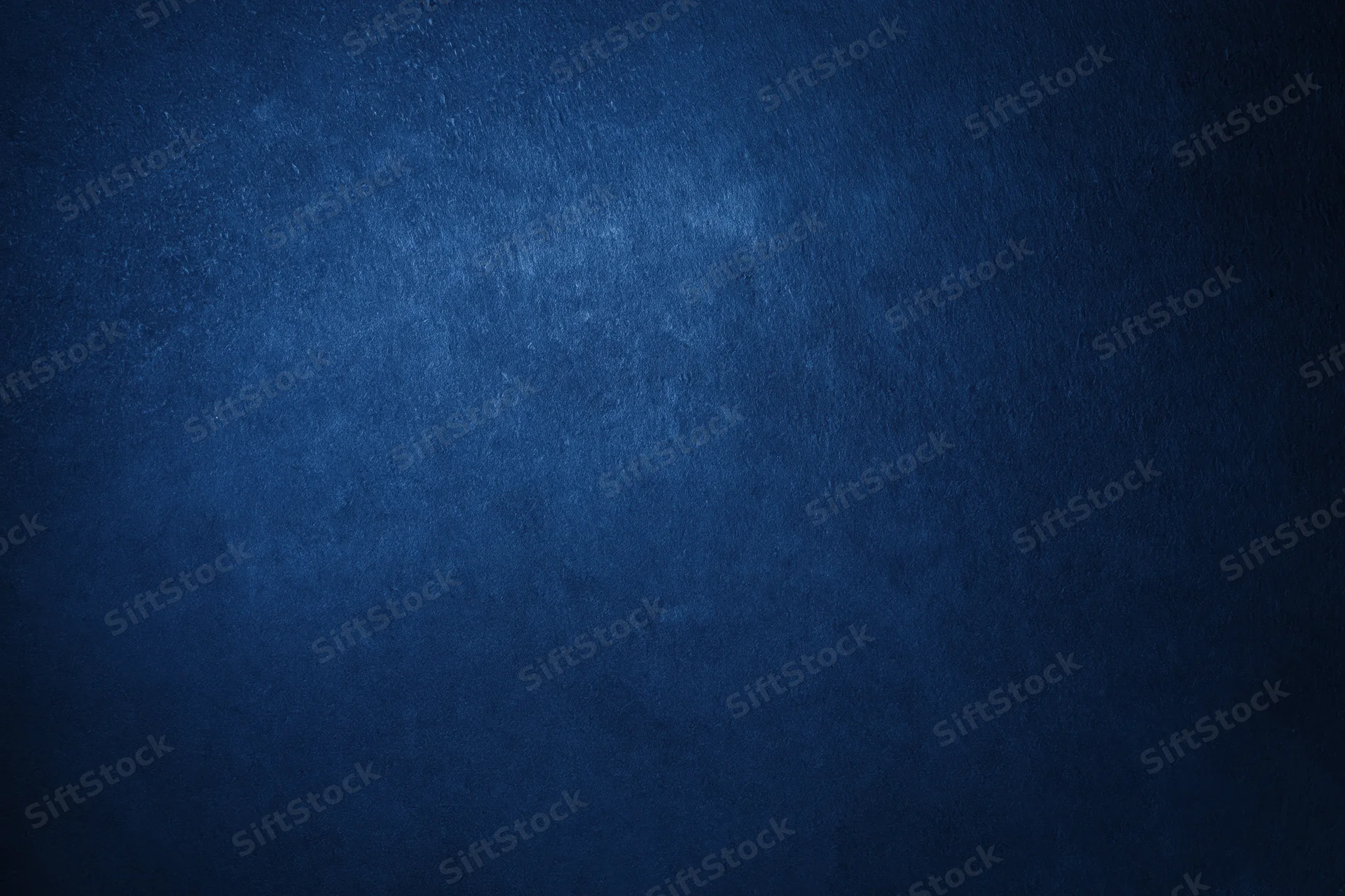 Closeup of deep navy blue textured wall surface filling the frame