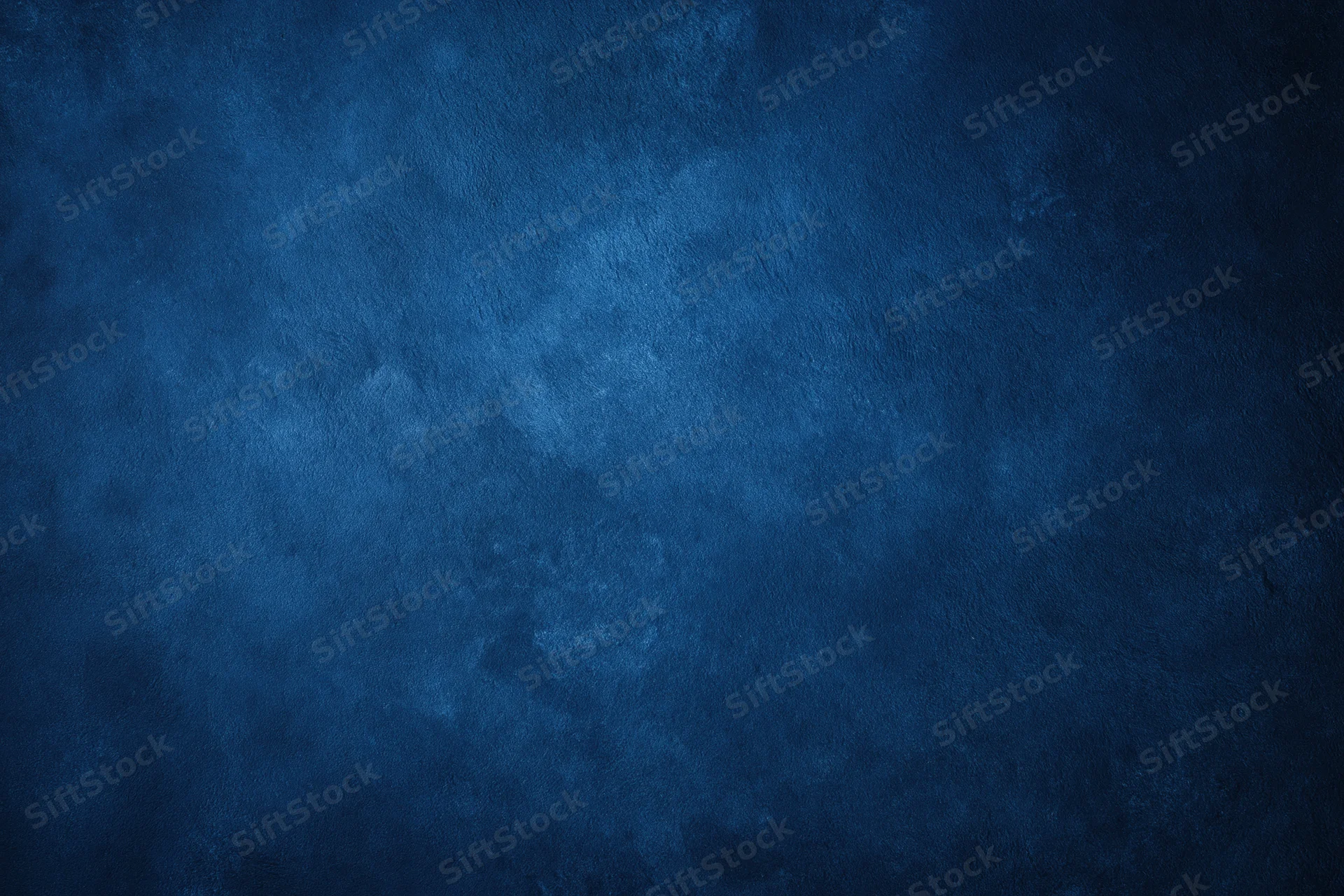 Close-up of a dark navy blue textured wall surface filling the frame