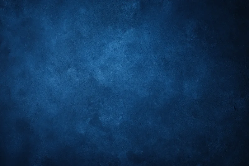 Close-up of a dark navy blue textured wall surface filling the frame