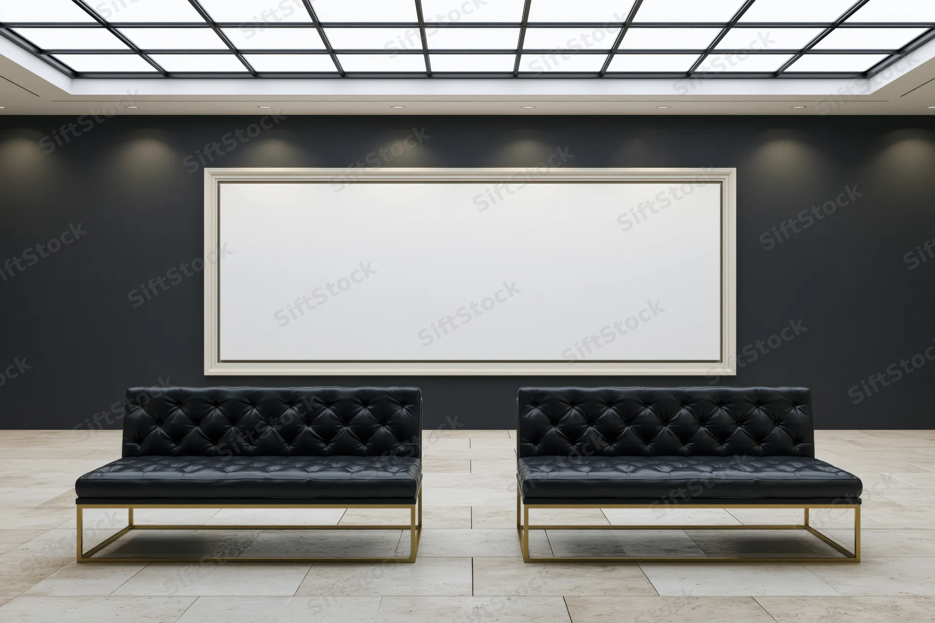Two black tufted sofas facing a blank white frame in a modern gallery interior