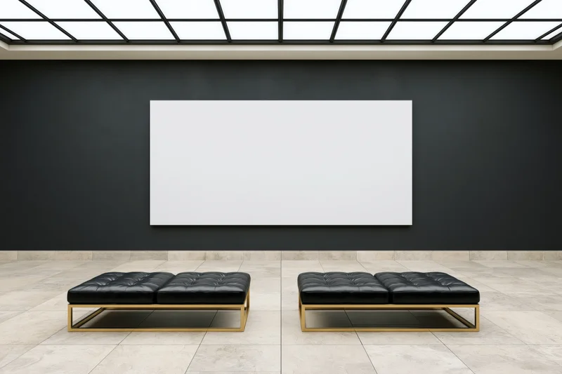 Empty contemporary art gallery interior with two black tufted benches and a blank white canvas on the wall