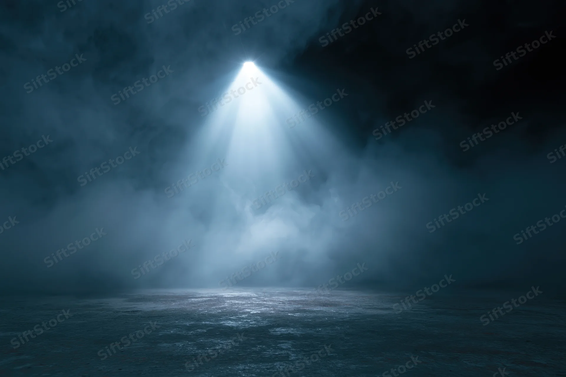 Single spotlight beam illuminating dark stage floor through smoke