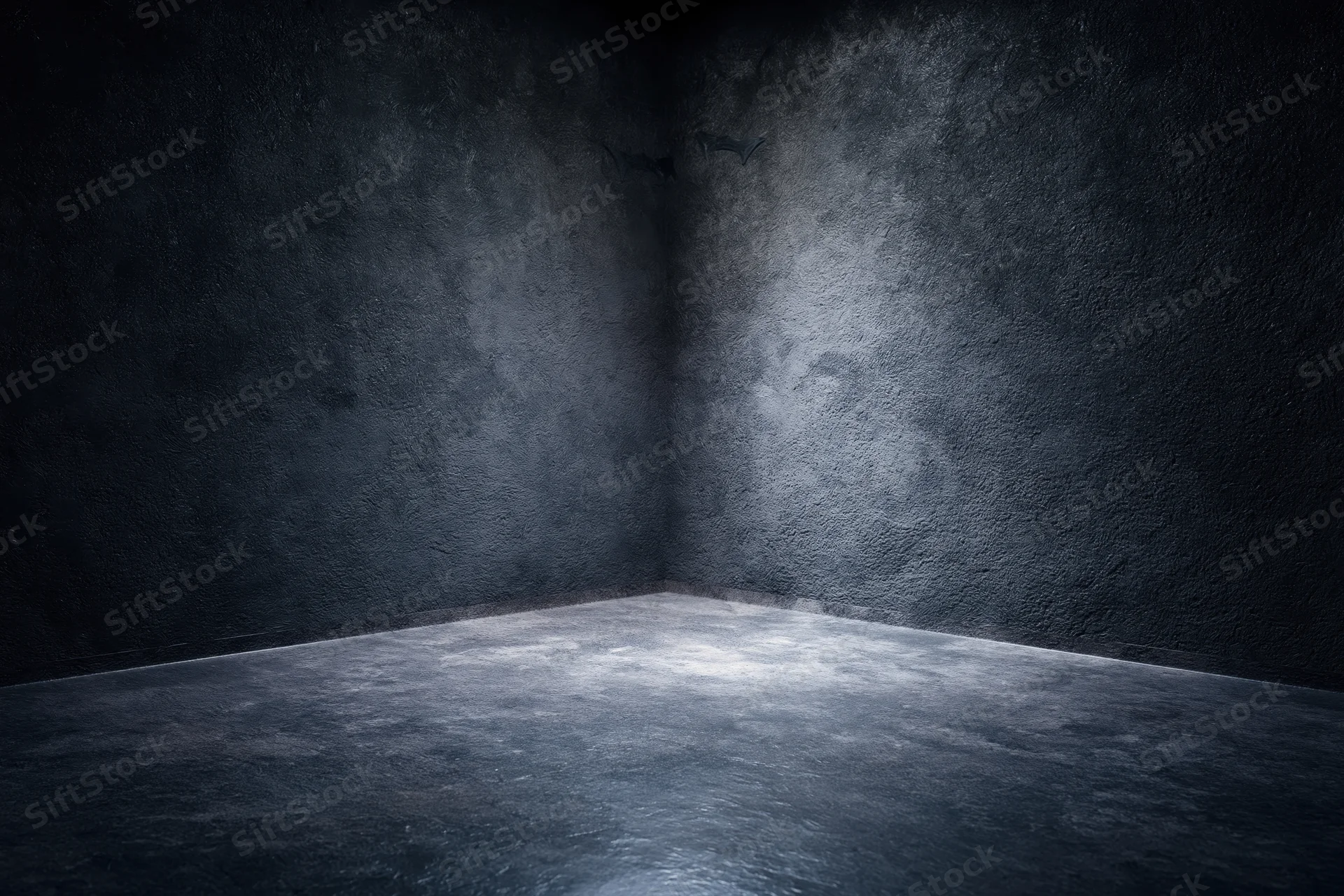 Dark textured concrete corner in empty studio space with dim lighting and shadowed walls