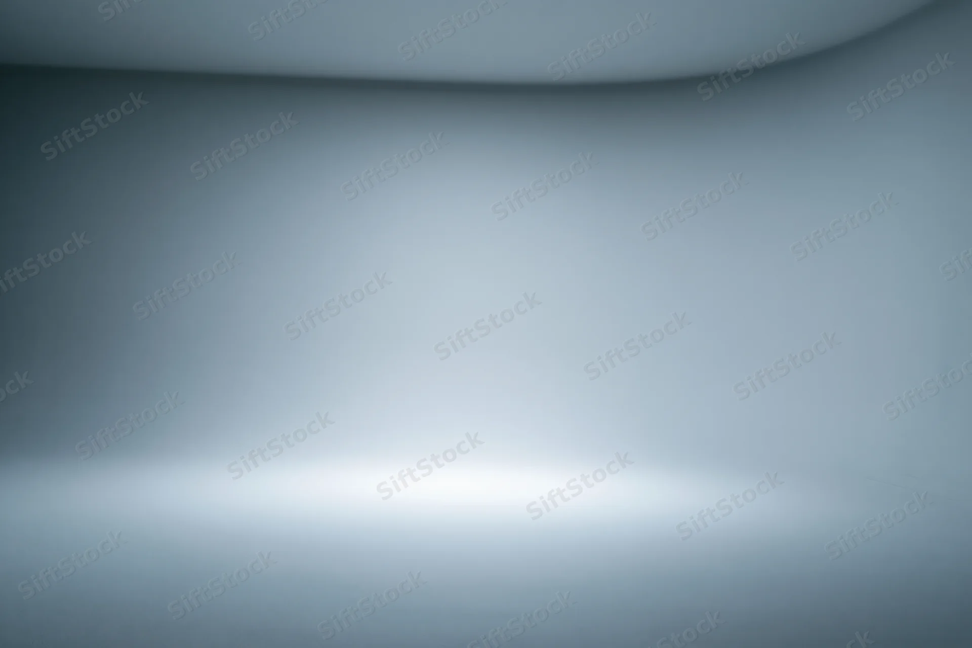 Smooth seamless grey backdrop in a professional photo studio space