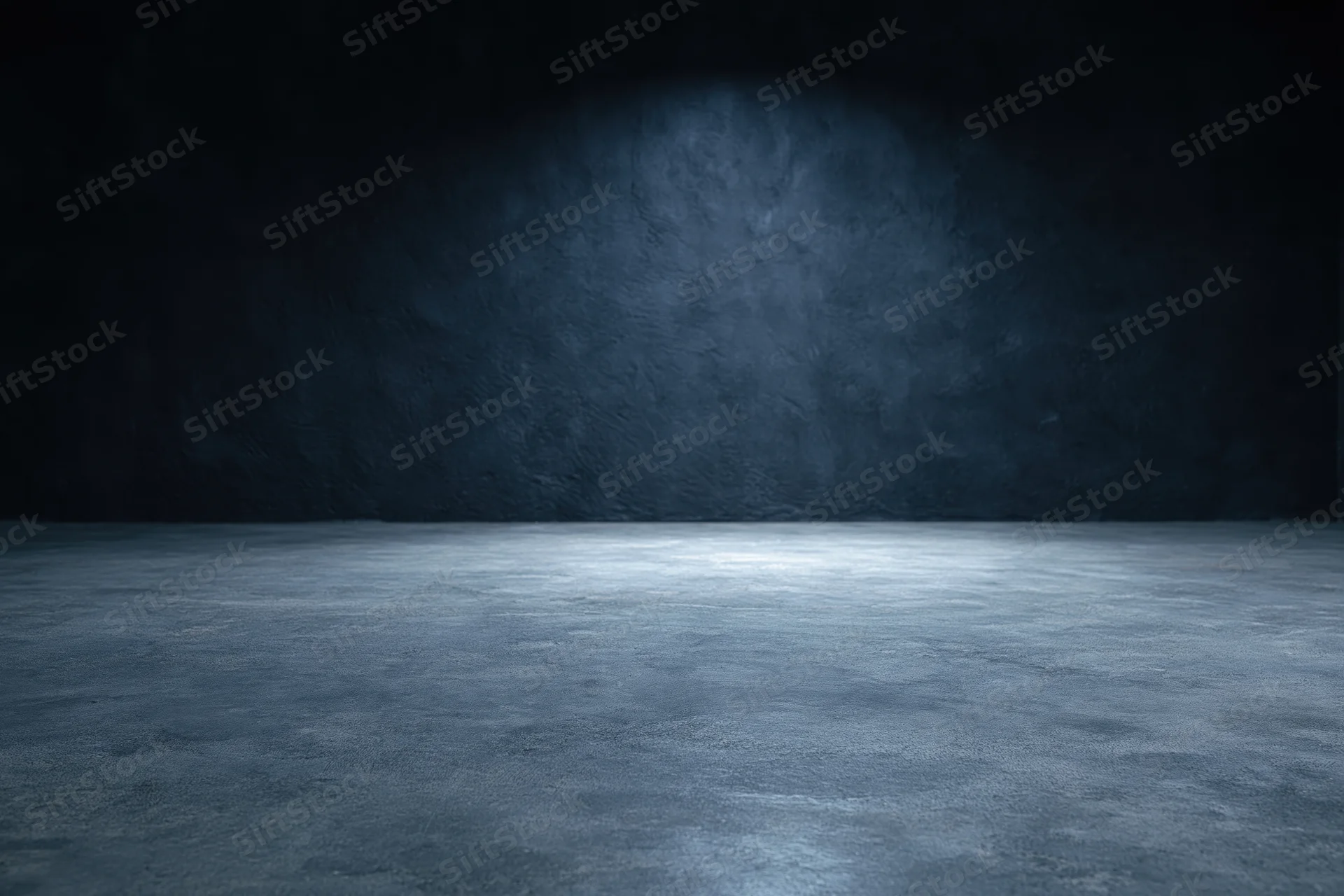 Empty concrete room with spotlight on dark textured wall and floor