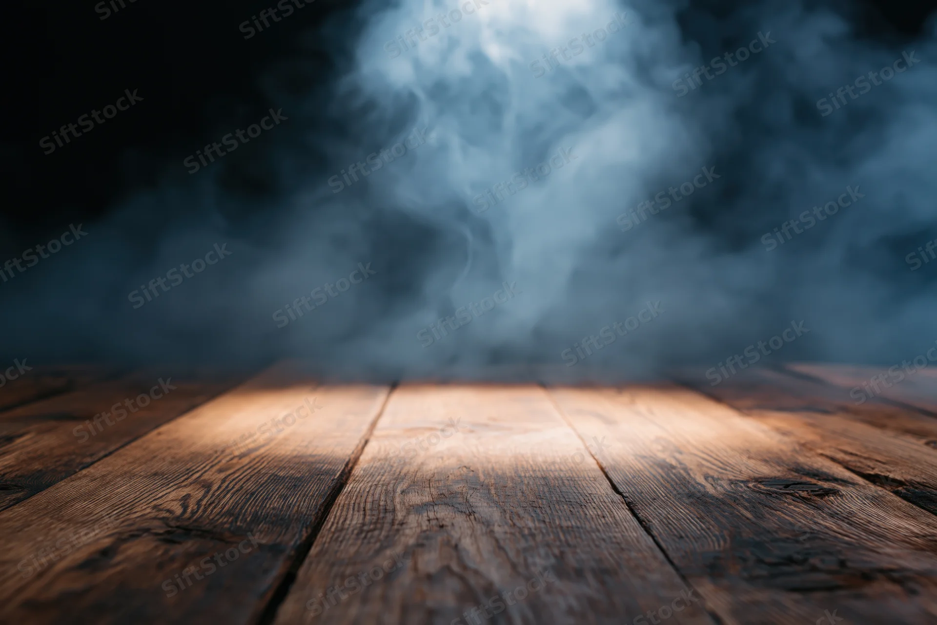 Rustic wooden table surface with drifting smoke and spotlight in dark atmosphere