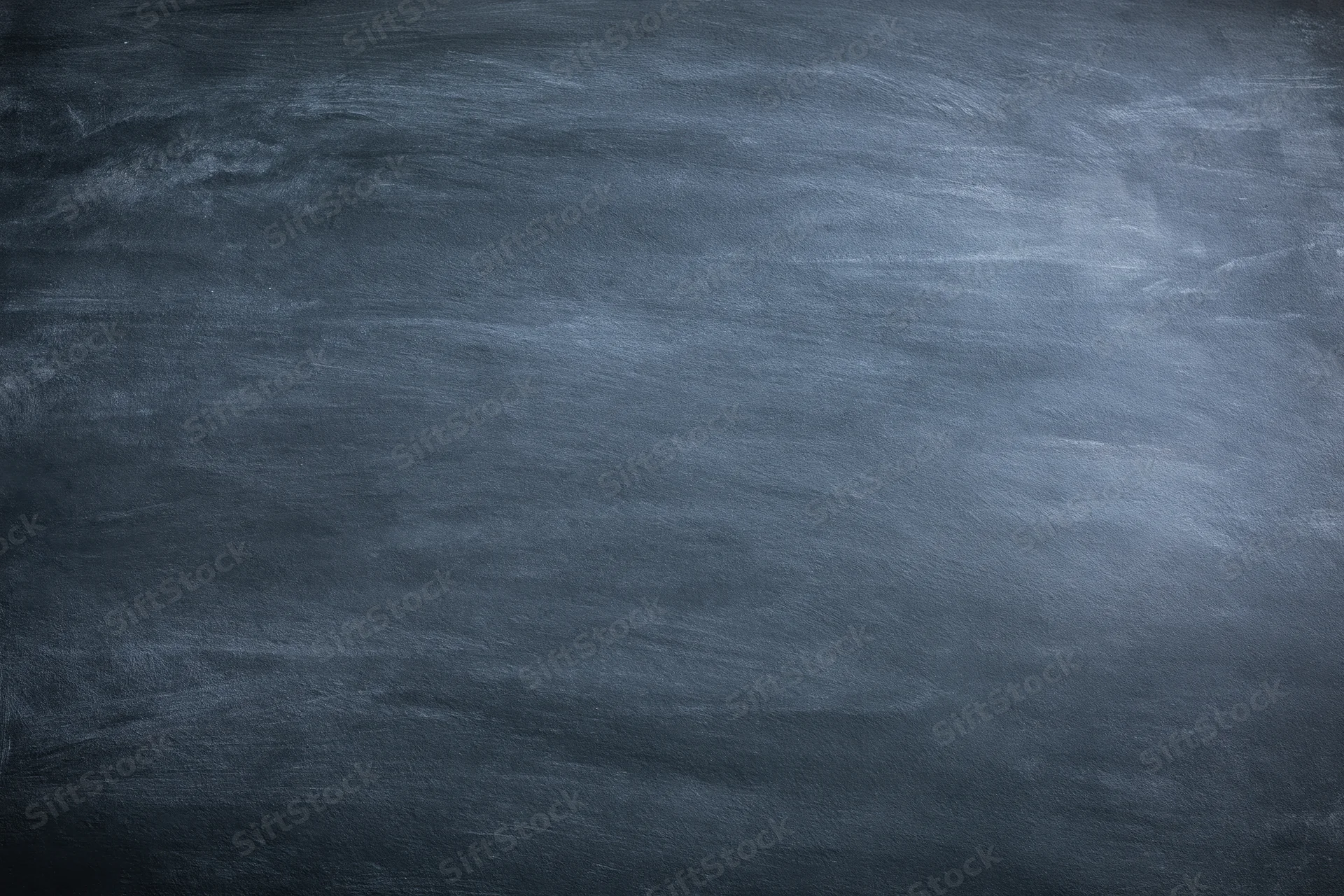 Dark grey chalkboard surface with subtle texture and faint smudges filling the frame