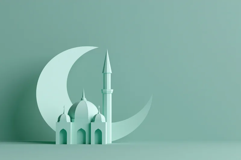 Miniature paper-cut style mosque with domes and a tall minaret against a green background