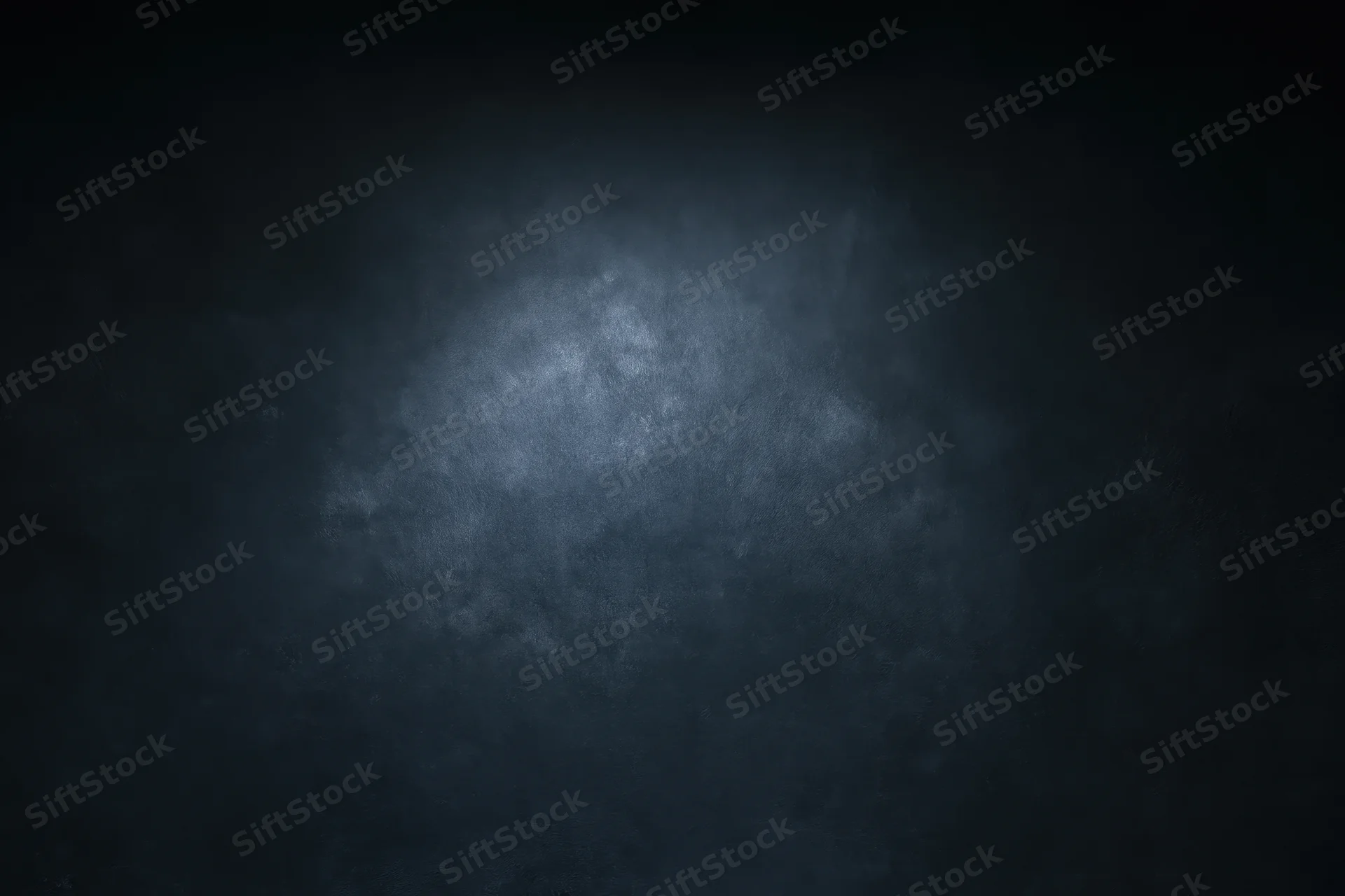 Dark textured surface with soft gradient lighting and subtle shadow effect
