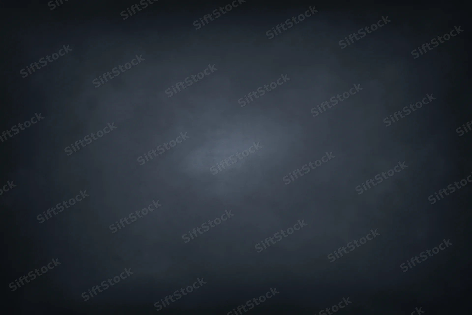 Dark charcoal studio backdrop with subtle centered spotlight gradient