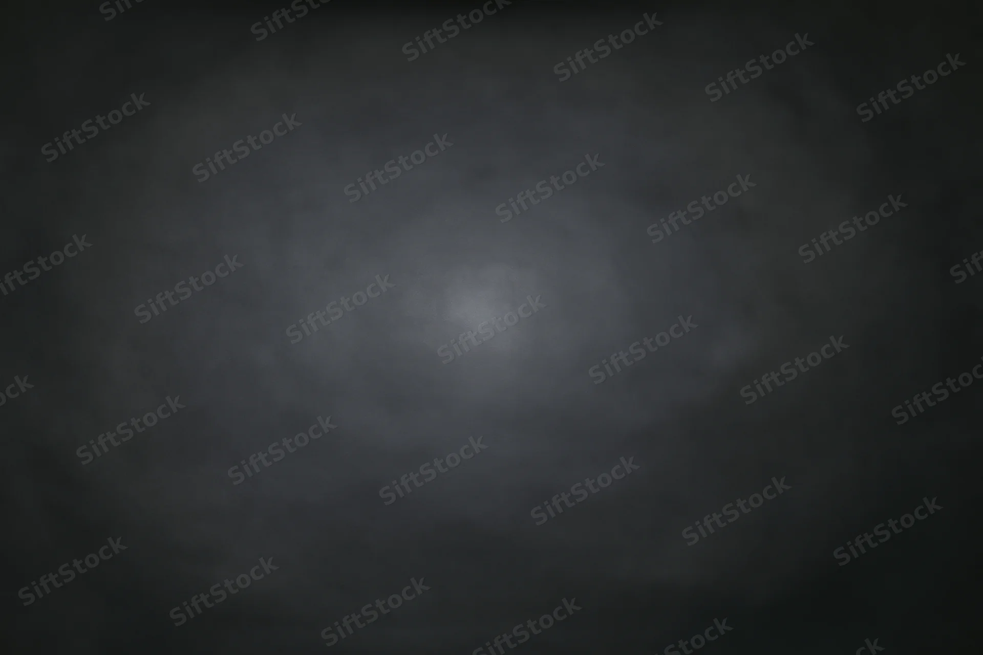 Dark charcoal studio backdrop with subtle centered light gradient
