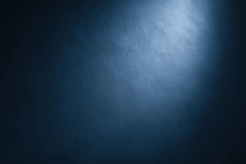 Dark navy blue gradient background with smooth matte texture and spotlight effect
