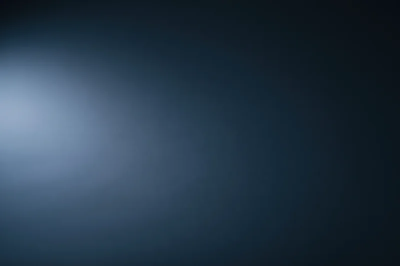 Dark navy blue gradient background with smooth matte surface and soft light transition