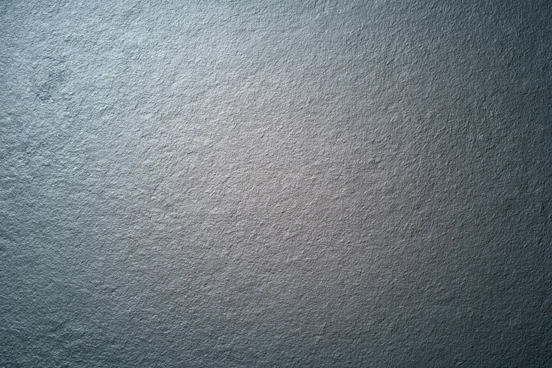 Textured grey matte surface filling the frame as a background