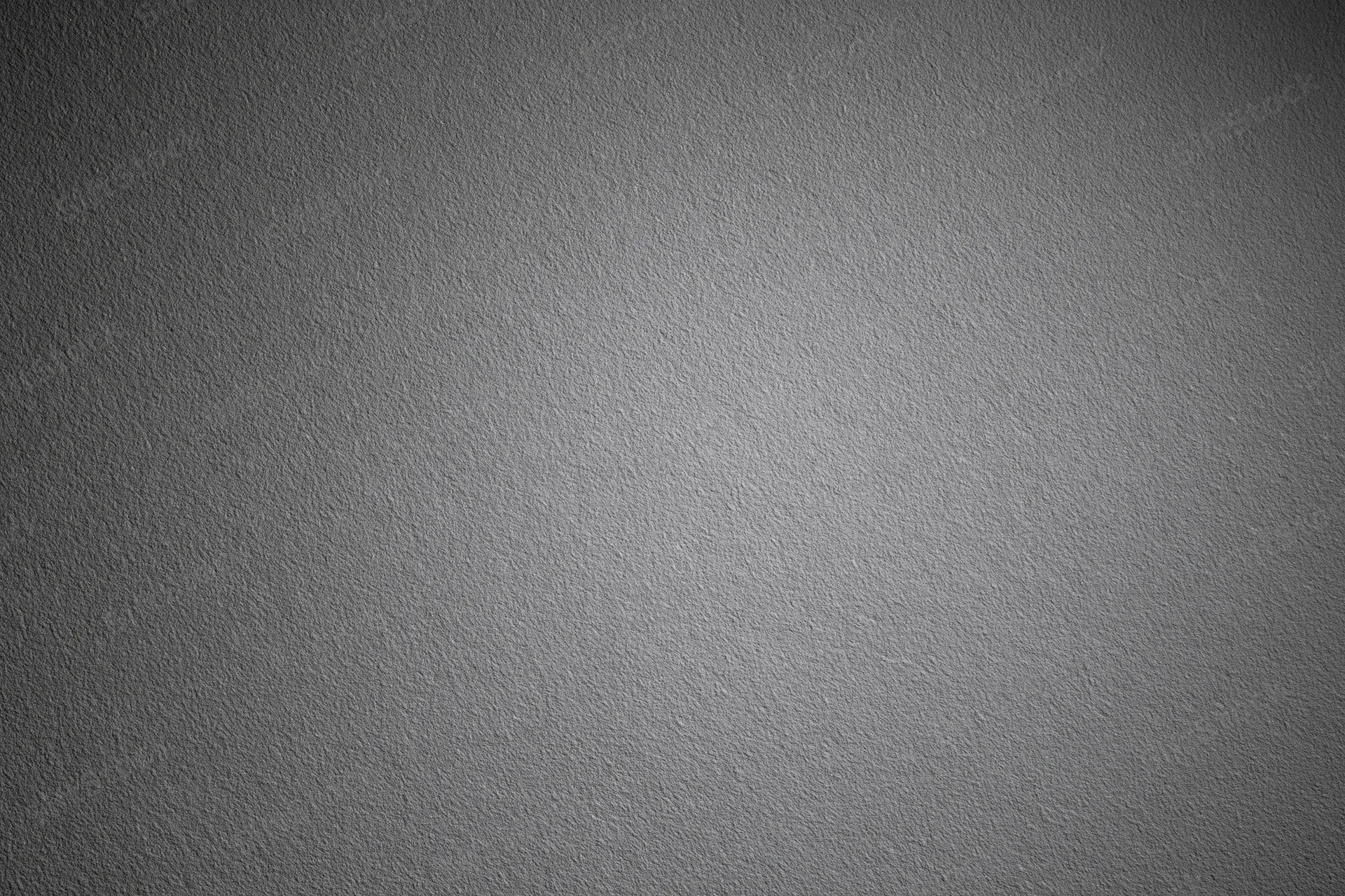 Plain matte grey textured surface filling the entire frame