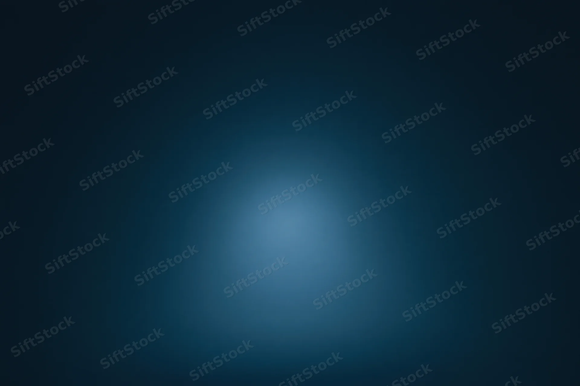Smooth navy blue gradient background with soft light centered in the frame