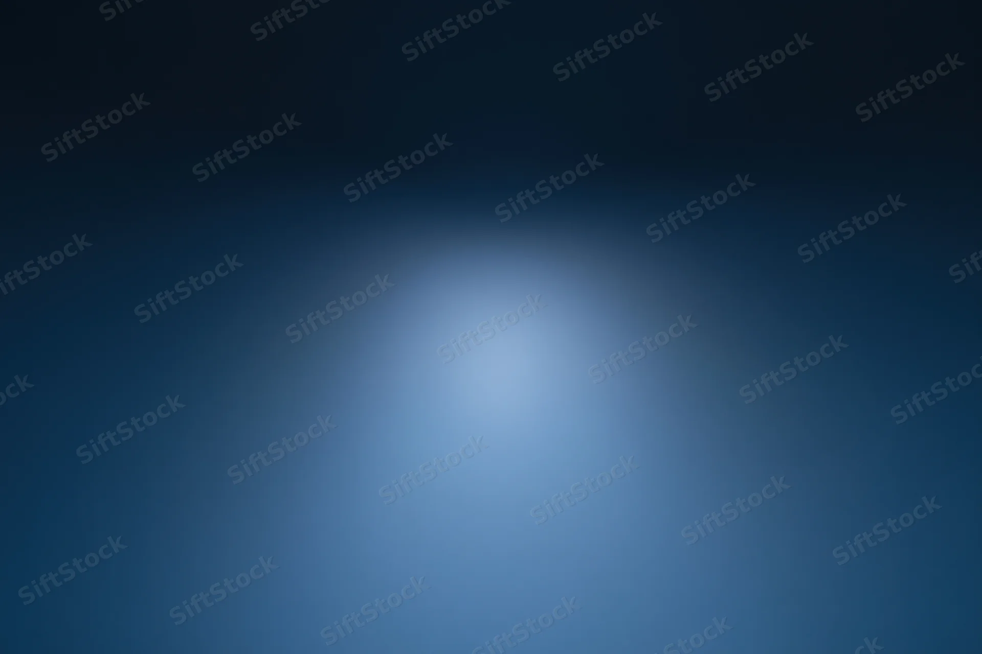 Smooth gradient blue background with soft light centered in frame