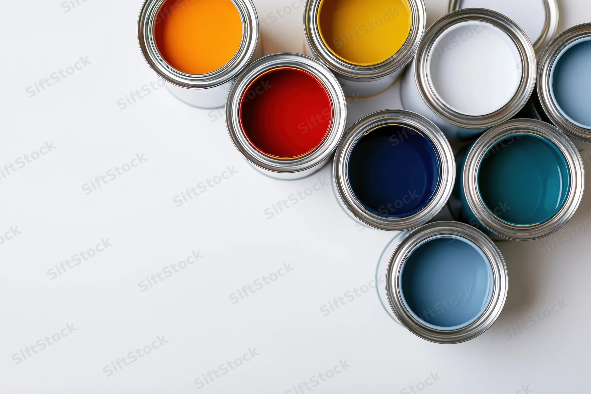 Open paint cans in various colors arranged diagonally on white surface