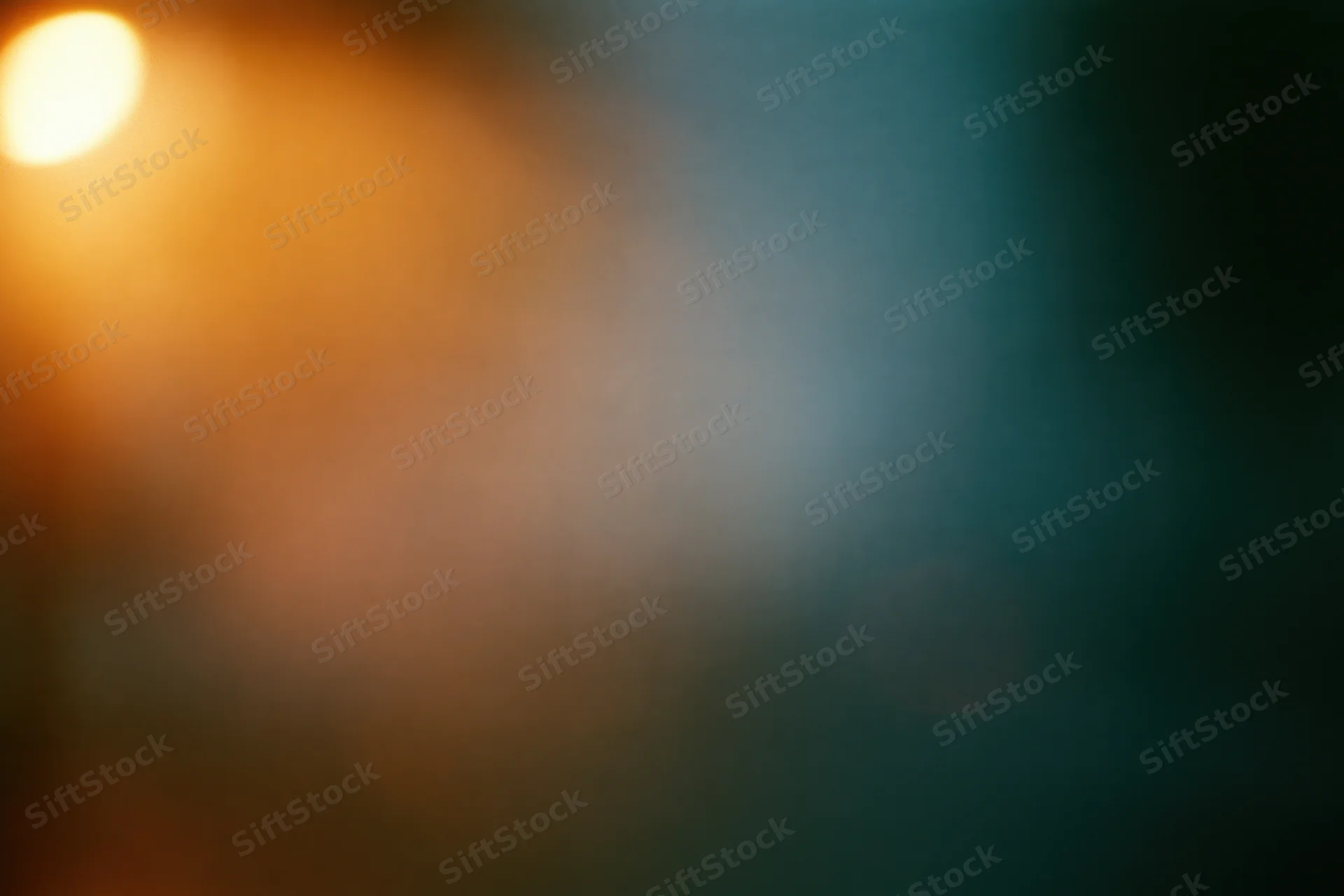 Soft out-of-focus abstract background with warm amber-orange glow and cool teal gradient