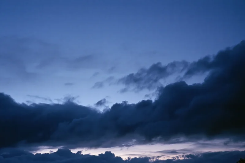 Twilight sky with dark storm clouds after sunset