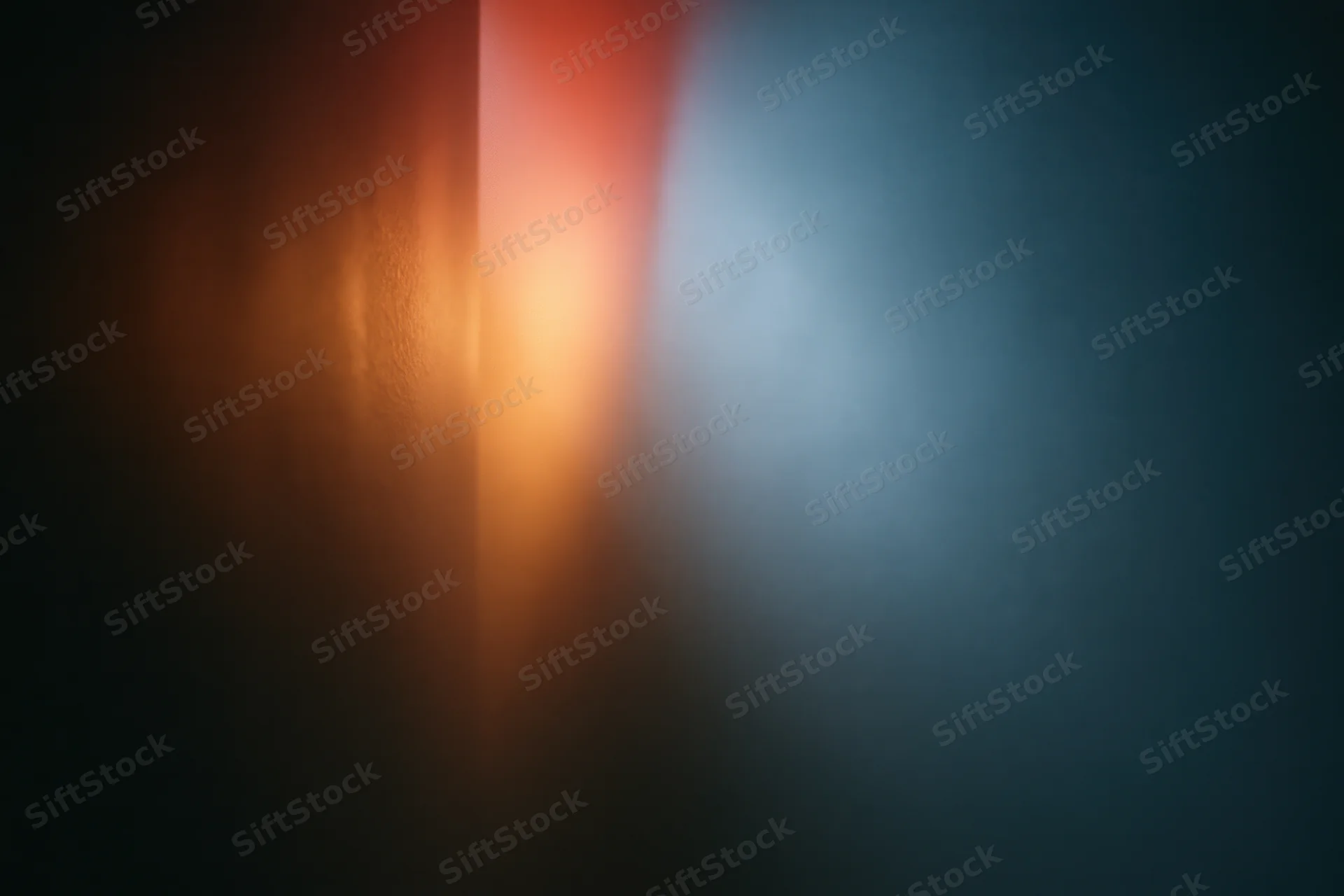 Contrasting red and blue light sources meeting in a dark interior space