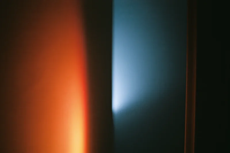 Contrasting orange and blue light sources in a dark interior space