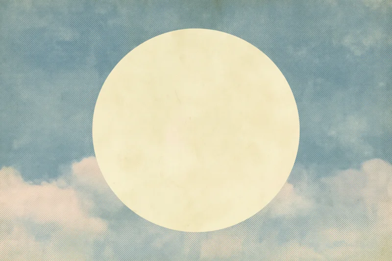 Pale cream circle on a vintage blue sky with clouds and halftone texture