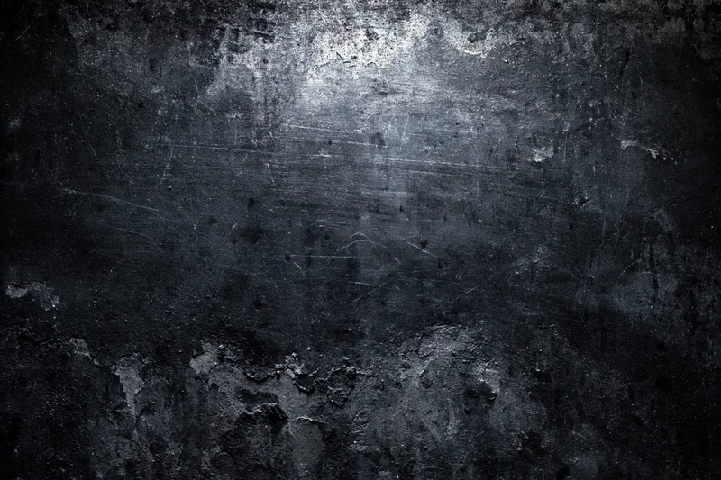 Weathered concrete wall surface with peeling paint and scratches
