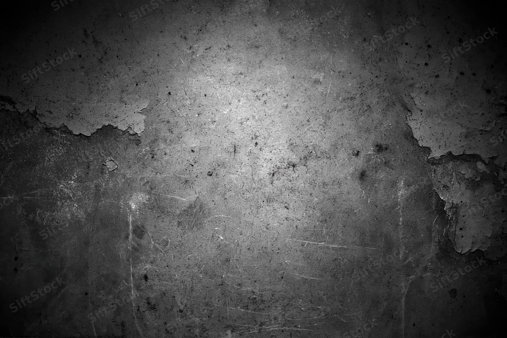 Weathered concrete wall with peeling paint and scratches, showing aged texture and industrial wear