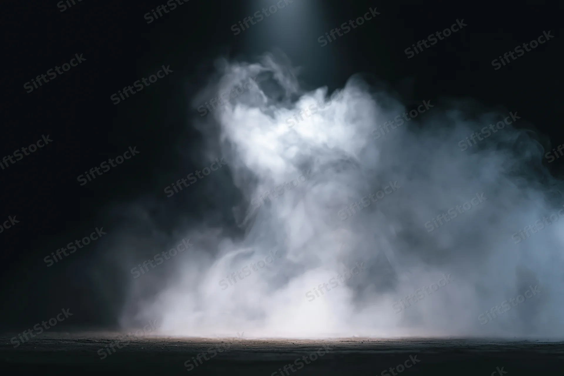 White smoke rising in a dark studio under a spotlight