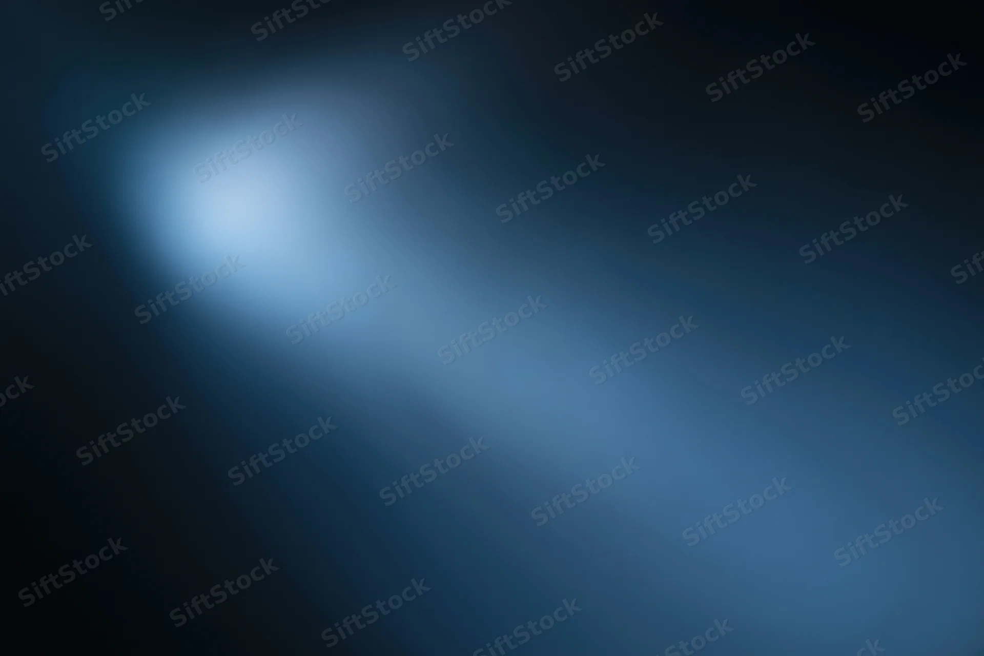 Smooth blue gradient background with soft light glow and dark edges