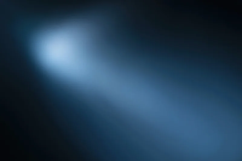 Smooth blue gradient background with soft light glow and dark edges