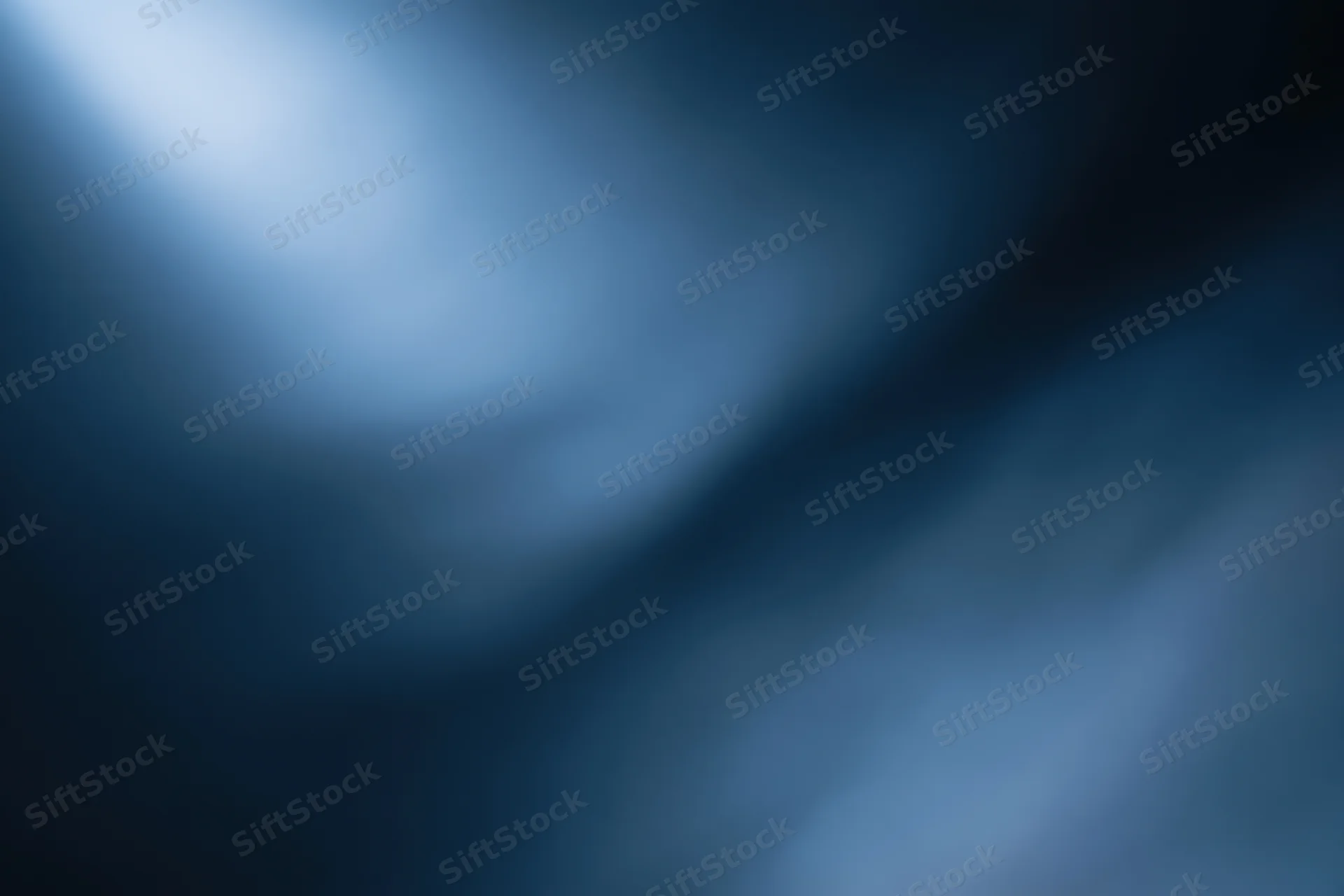 Smooth blue gradient background with soft light and dark tones