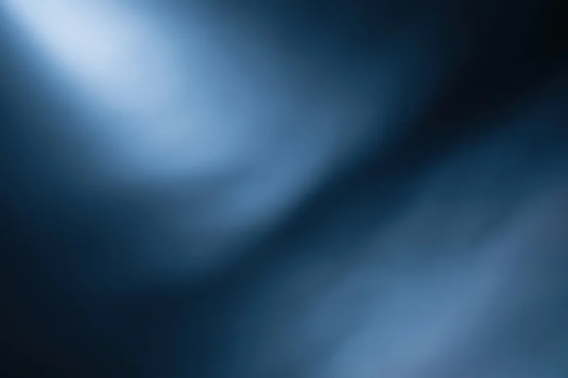 Smooth blue gradient background with soft light and dark tones