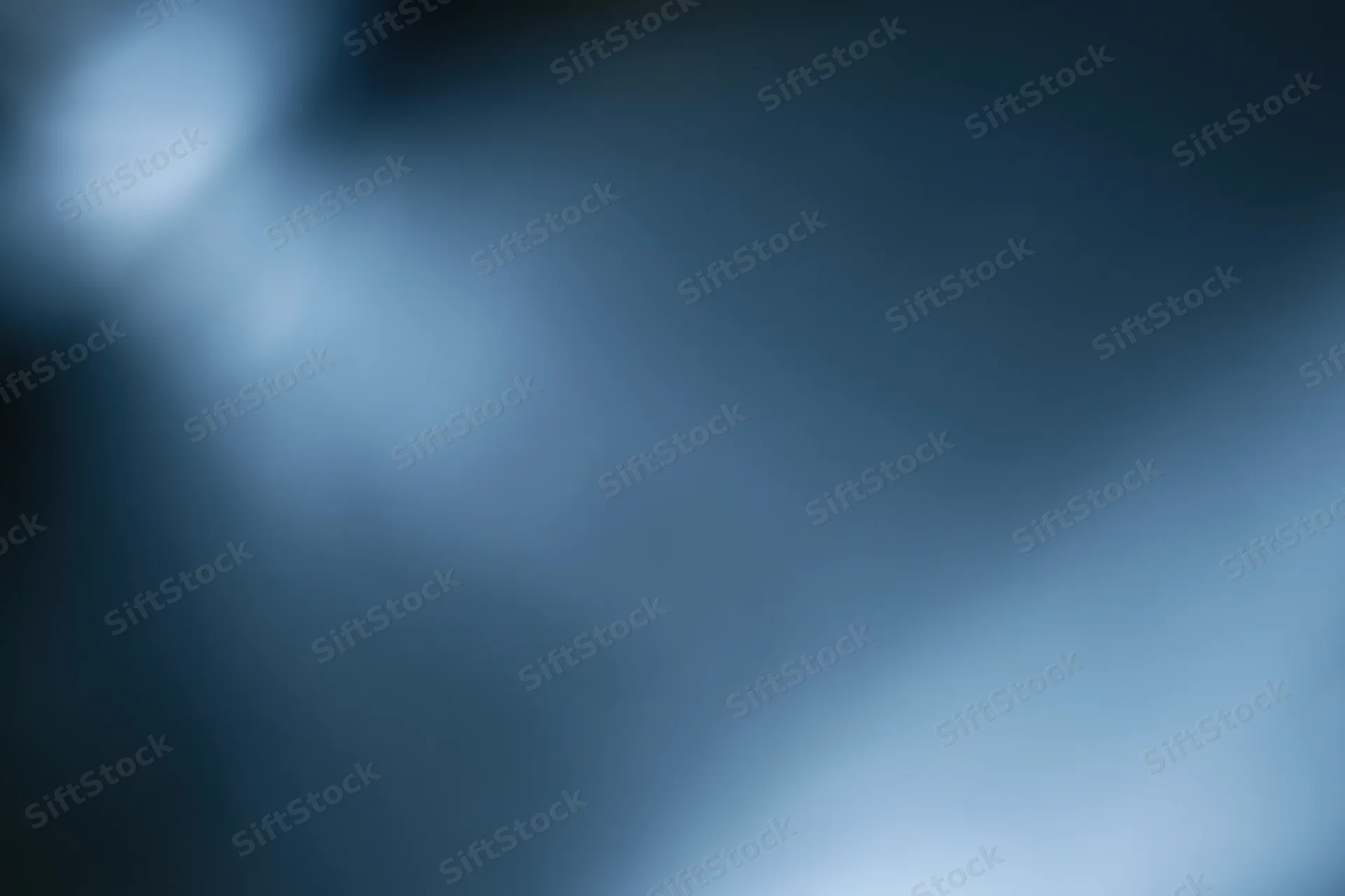 Smooth blue gradient background with soft blurred light effects
