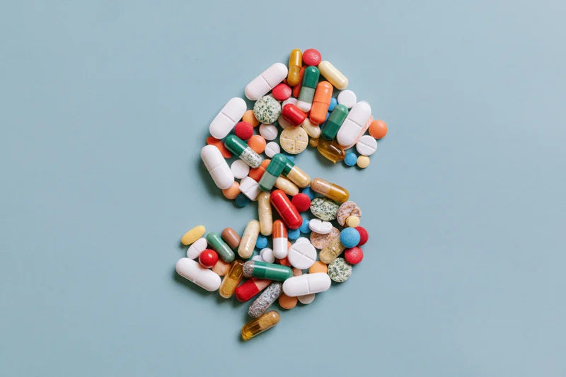 Assorted colorful pills capsules and tablets arranged in the shape