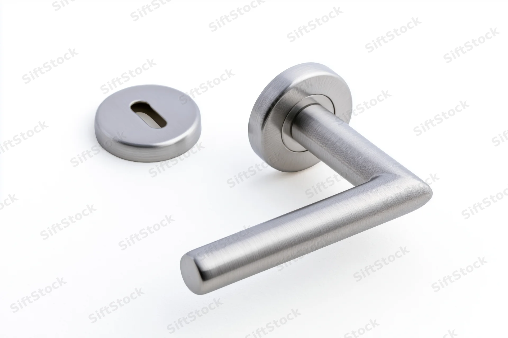 Brushed stainless steel door lever handle and round keyhole plate on white background