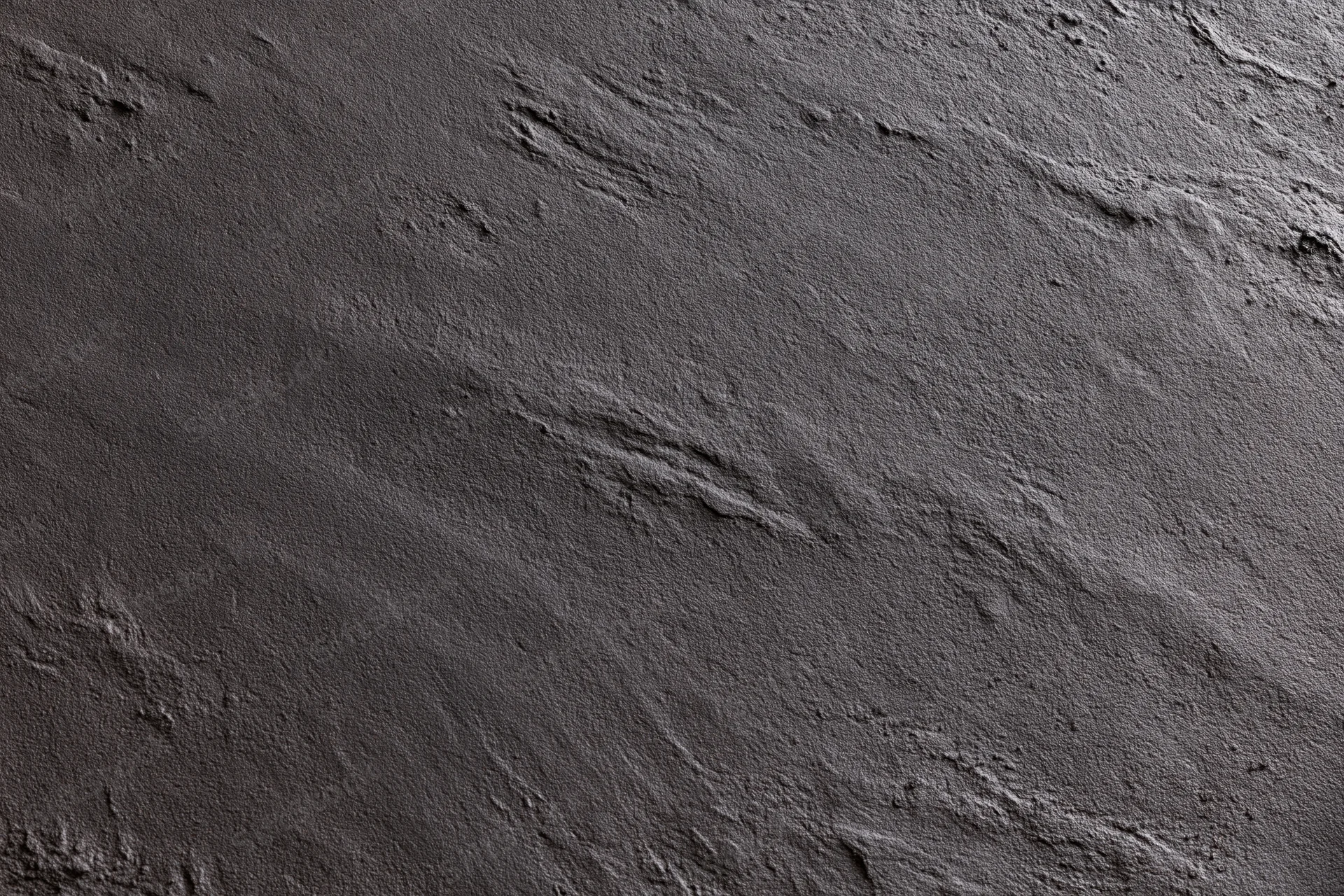 Close-up of dark charcoal concrete wall texture